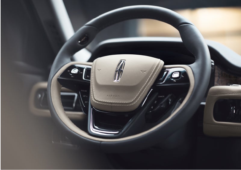 The intuitively placed controls of the steering wheel on a 2023 Lincoln Aviator® SUV | Jenkins & Wynne Lincoln in Clarksville TN