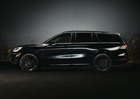 A 2024 Lincoln Aviator® SUV is shown in the Infinite Black exterior color | Jenkins & Wynne Lincoln in Clarksville TN