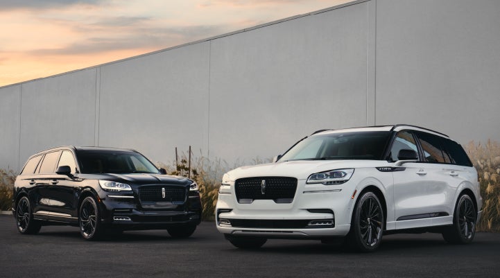 Two Lincoln Aviator® SUVs are shown with the available Jet Appearance Package | Jenkins & Wynne Lincoln in Clarksville TN