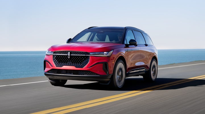 A 2024 Lincoln Nautilus® SUV is being driven on a seaside roadway. | Jenkins & Wynne Lincoln in Clarksville TN