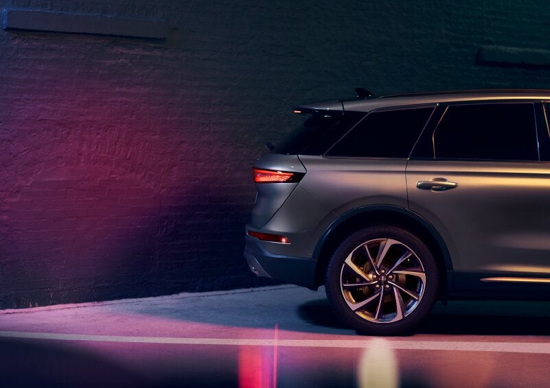 A dramatization of a 2025 Lincoln Corsair® SUV is shown backing up toward a wall. | Jenkins & Wynne Lincoln in Clarksville TN