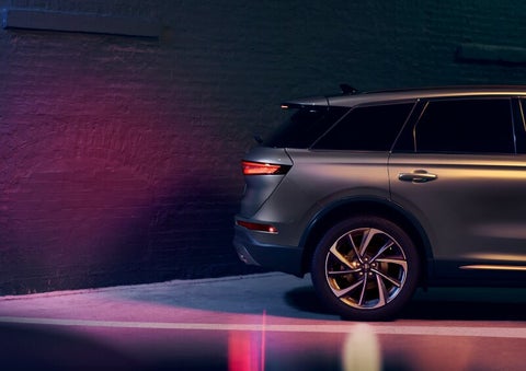 A dramatization of a 2025 Lincoln Corsair® SUV is shown backing up toward a wall. | Jenkins & Wynne Lincoln in Clarksville TN