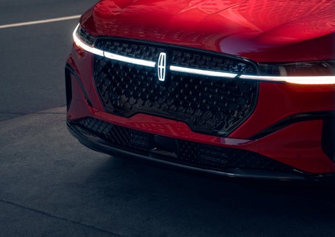 The available front LED light bar and center Lincoln Star logo glow at dusk. | Jenkins & Wynne Lincoln in Clarksville TN