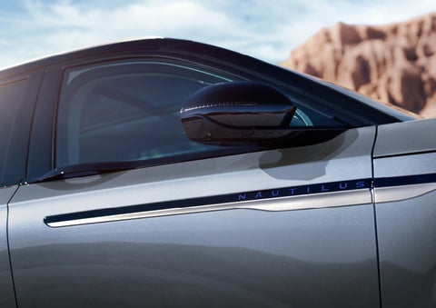 Blue lettering on the side of the vehicle that reads nautilus indicates the available hybrid powertrain. | Jenkins & Wynne Lincoln in Clarksville TN