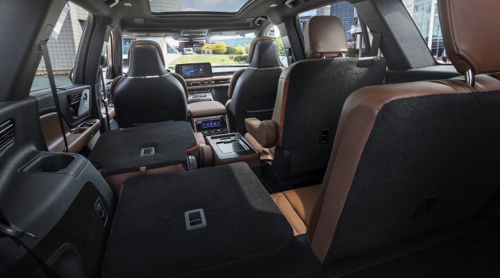 One side of the PowerFold® third-row seat and a second-row seat are folded forward in the 2026 Lincoln Aviator® SUV. | Jenkins & Wynne Lincoln in Clarksville TN