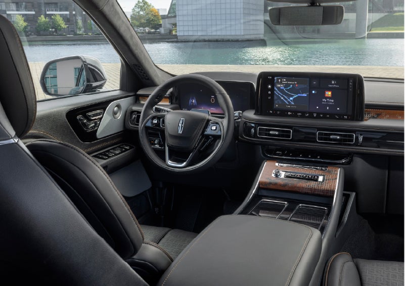 The interior of the 2026 Lincoln Aviator® SUV is shown parked with a view of a harbor through the windshield. | Jenkins & Wynne Lincoln in Clarksville TN