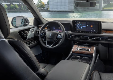 The interior of the 2026 Lincoln Aviator® SUV is shown parked with a view of a harbor through the windshield. | Jenkins & Wynne Lincoln in Clarksville TN