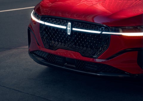 The available front LED light bar and center Lincoln Star logo glow at dusk. | Jenkins & Wynne Lincoln in Clarksville TN